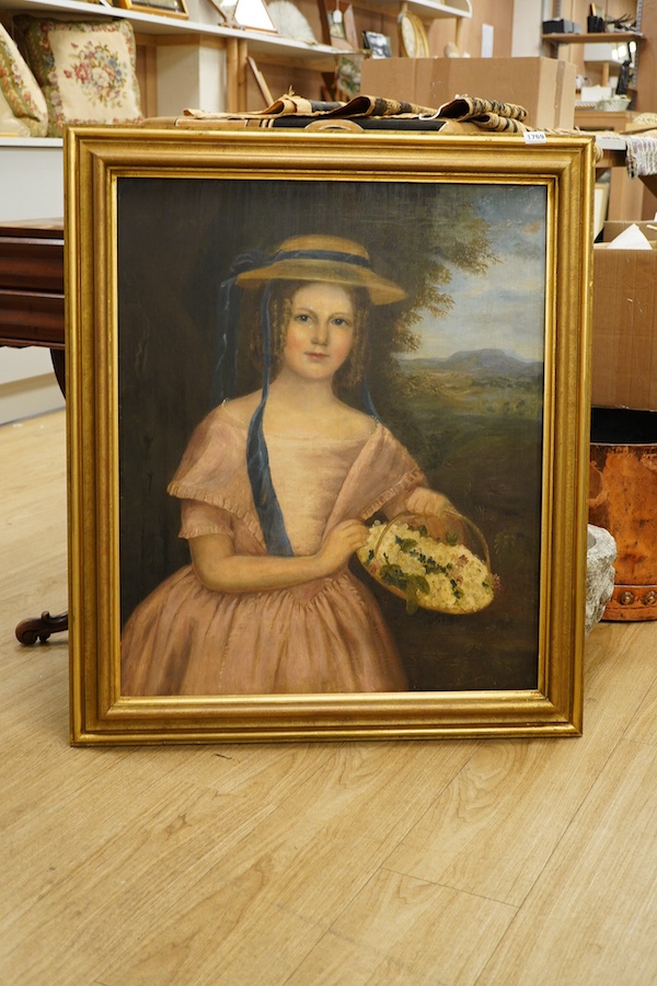 Early Victorian School, oil on canvas, Half length portrait of a young girl holding a basket of flowers before a landscape, unsigned, 74 x 62cm, gilt frame